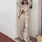 Dames set met geometrische print - 2-delig shirt en broek met wijde pijpen
